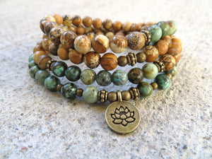 african turquoise and picture jasper finished with a lotus charm - convertible to necklace and bracelet in 108 mala bead count